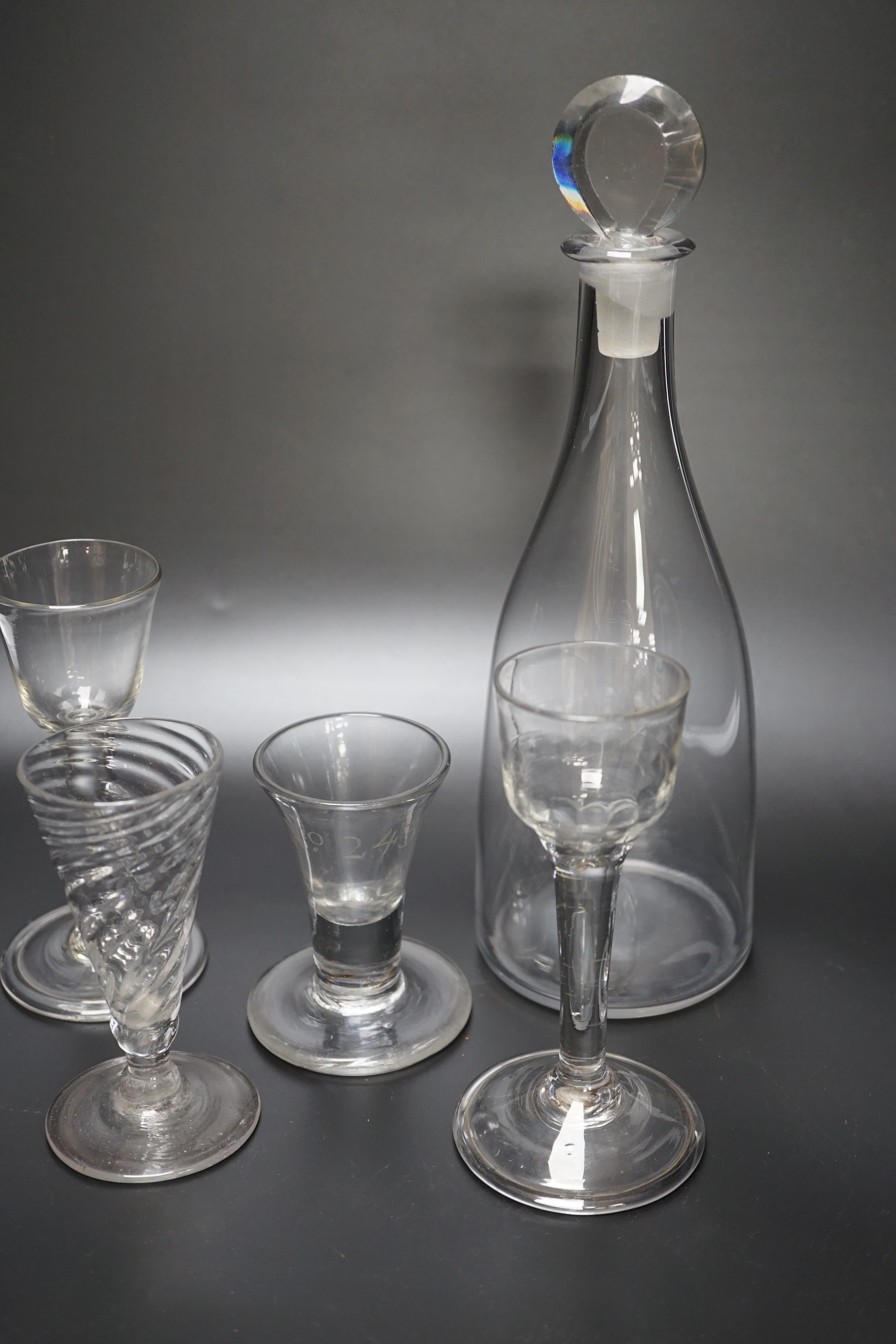 A group of four George III wine glasses and a mallet-shaped decanter, decanter 29cm